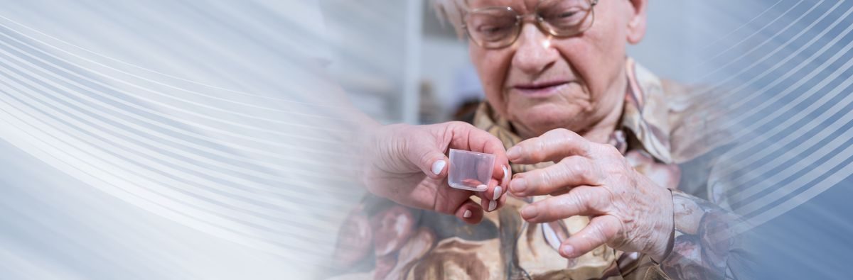 A nurse helping with medication